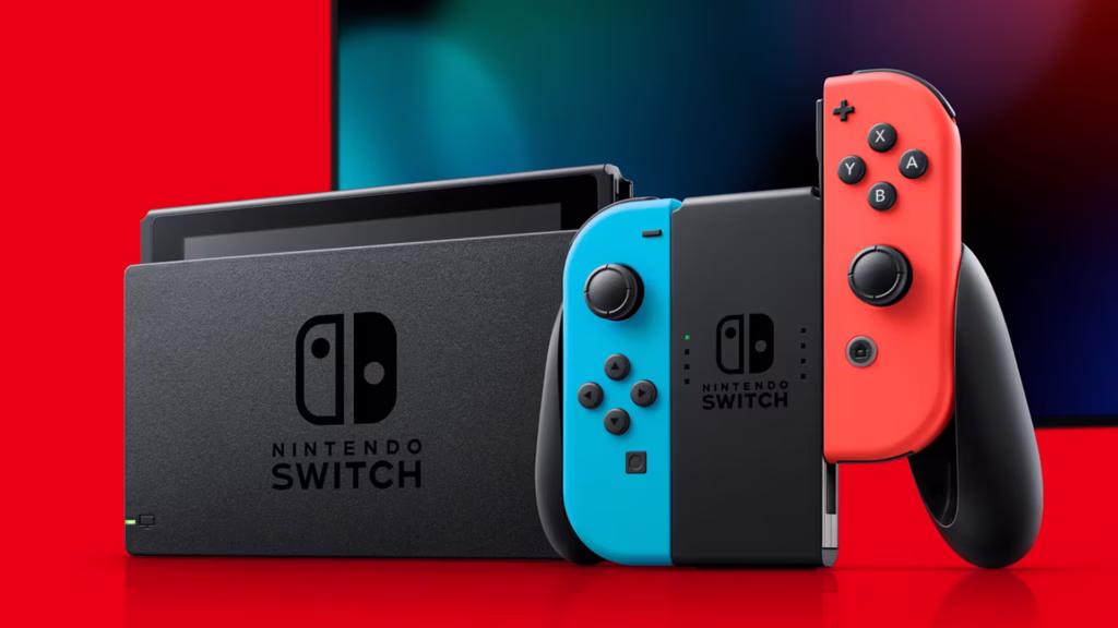 A Nintendo Switch console with a red and blue Joy-Con controller, positioned in front of its dock with a vibrant red and black background.